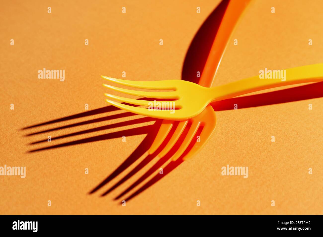 Plastic forks on color background Stock Photo Alamy