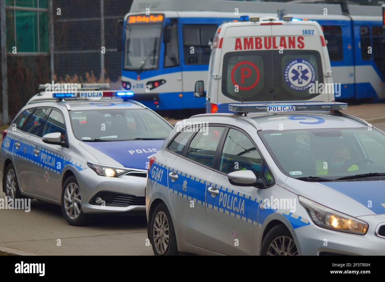 Accident involving streetcar and passenger - police, medical and traffic police cars. The place of the incident in Krakow Stock Photo