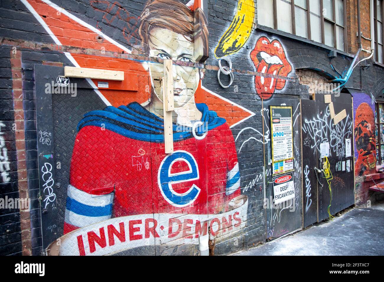 ACDC lane Melbourne city centre with street art and paintings paying ...