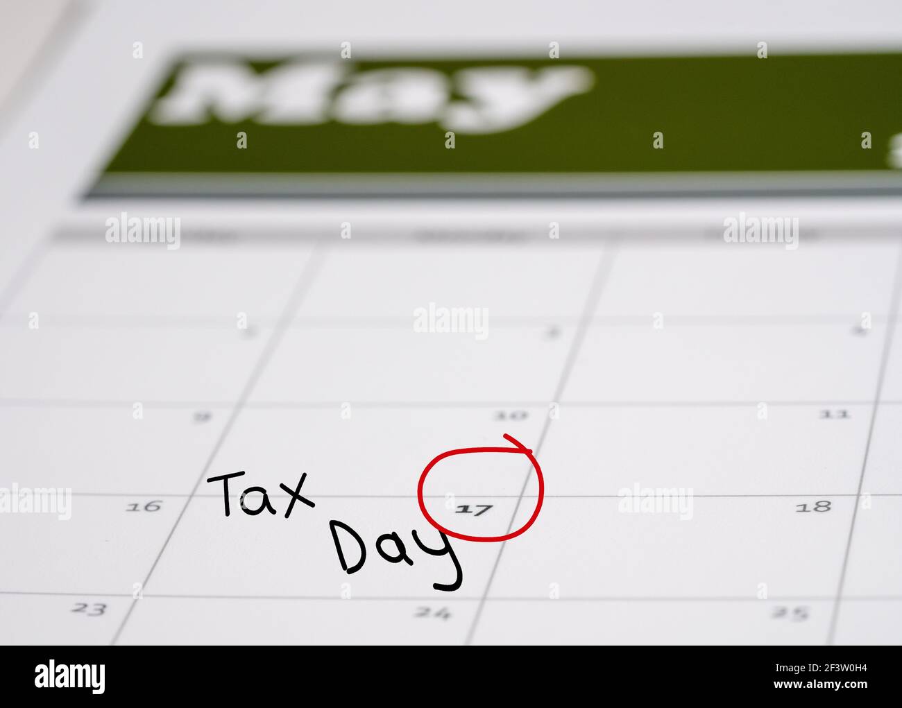 Calendar with Tax Day note inserted in the date for May 17 to illustrate the new tax return filing date of f17th May 2021. Stock Photo