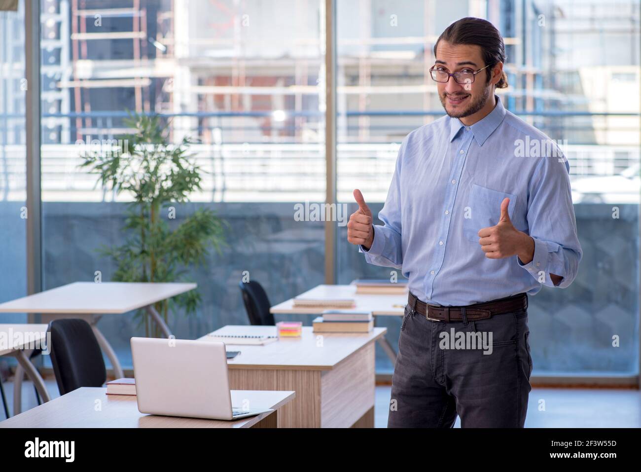 Young teacher in the classroom Stock Photo