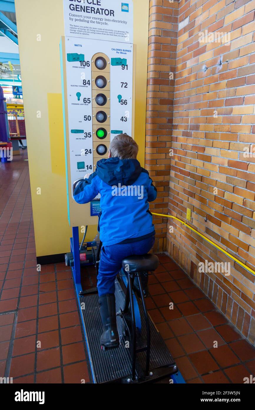 A young boy tries to generate electricity at Bicycle Generator exhibit at the Science Central science museum in Fort Wayne, Indiana, USA Stock Photo - Alamy A young boy tries to generate electricity at Bicycle Generator exhibit at the Science Central science museum in Fort Wayne, Indiana, USA Stock Photo - Alamy