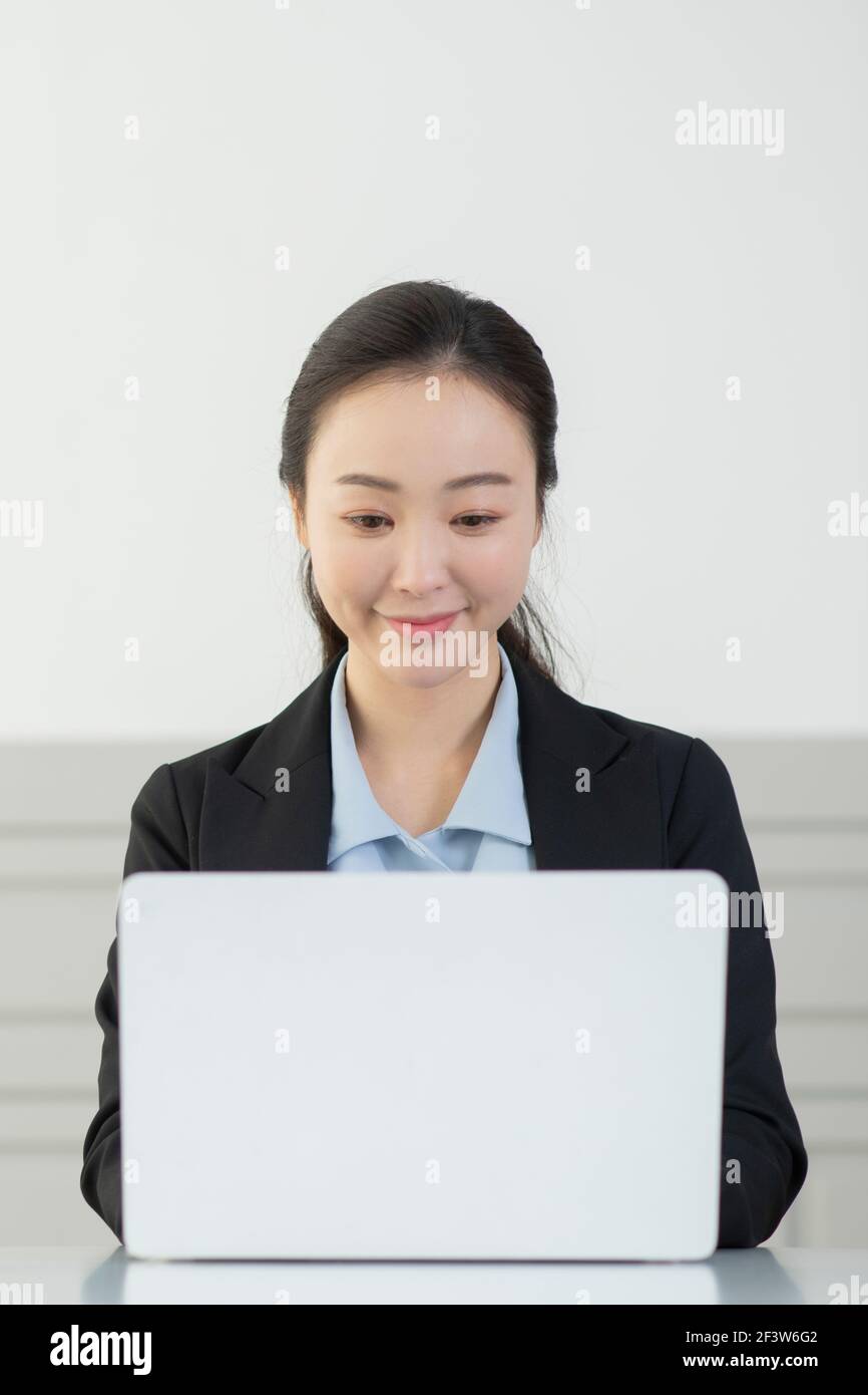 remote work, working at home concept of Asian woman in smart casual