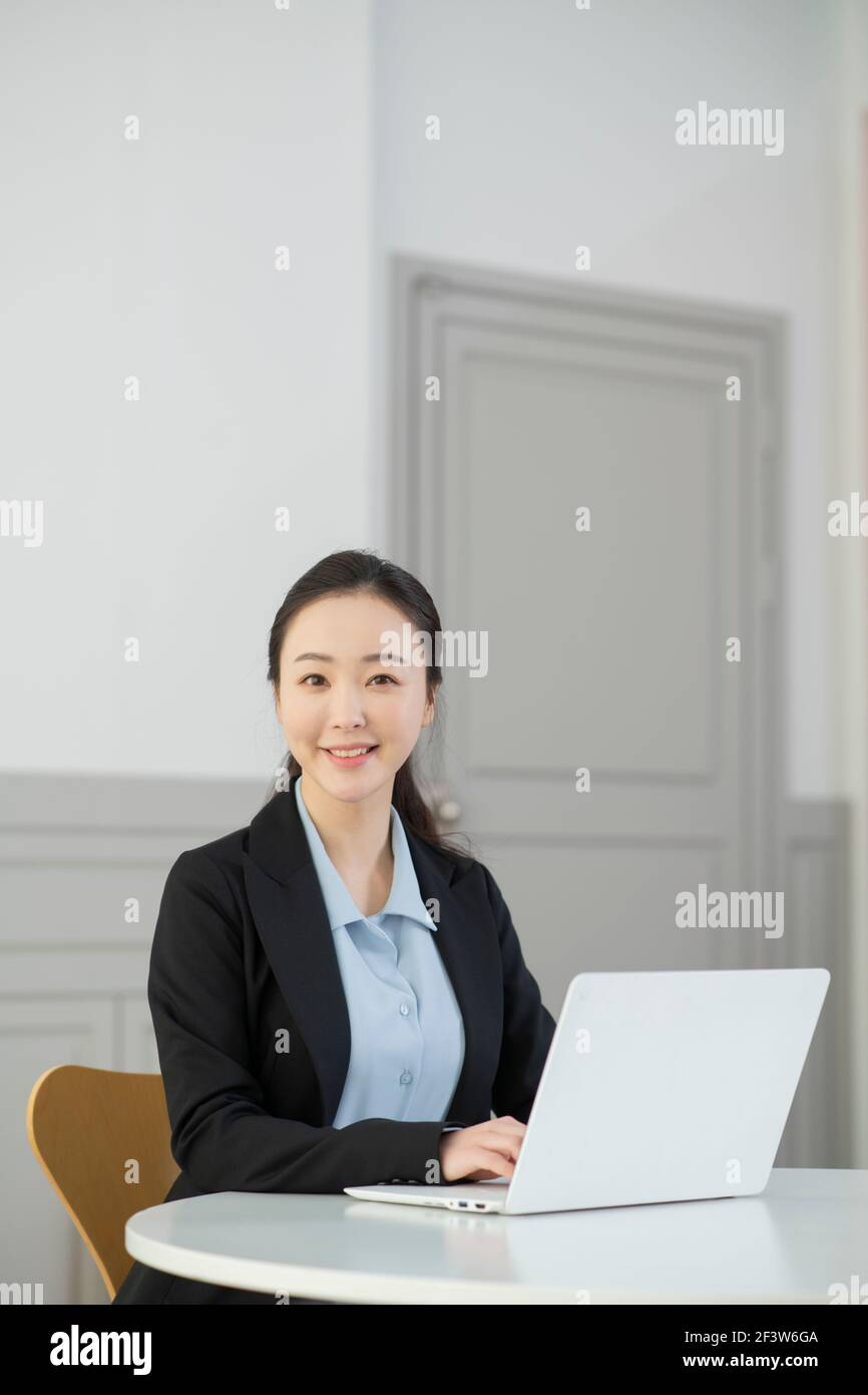 remote work, working at home concept of Asian woman in smart casual