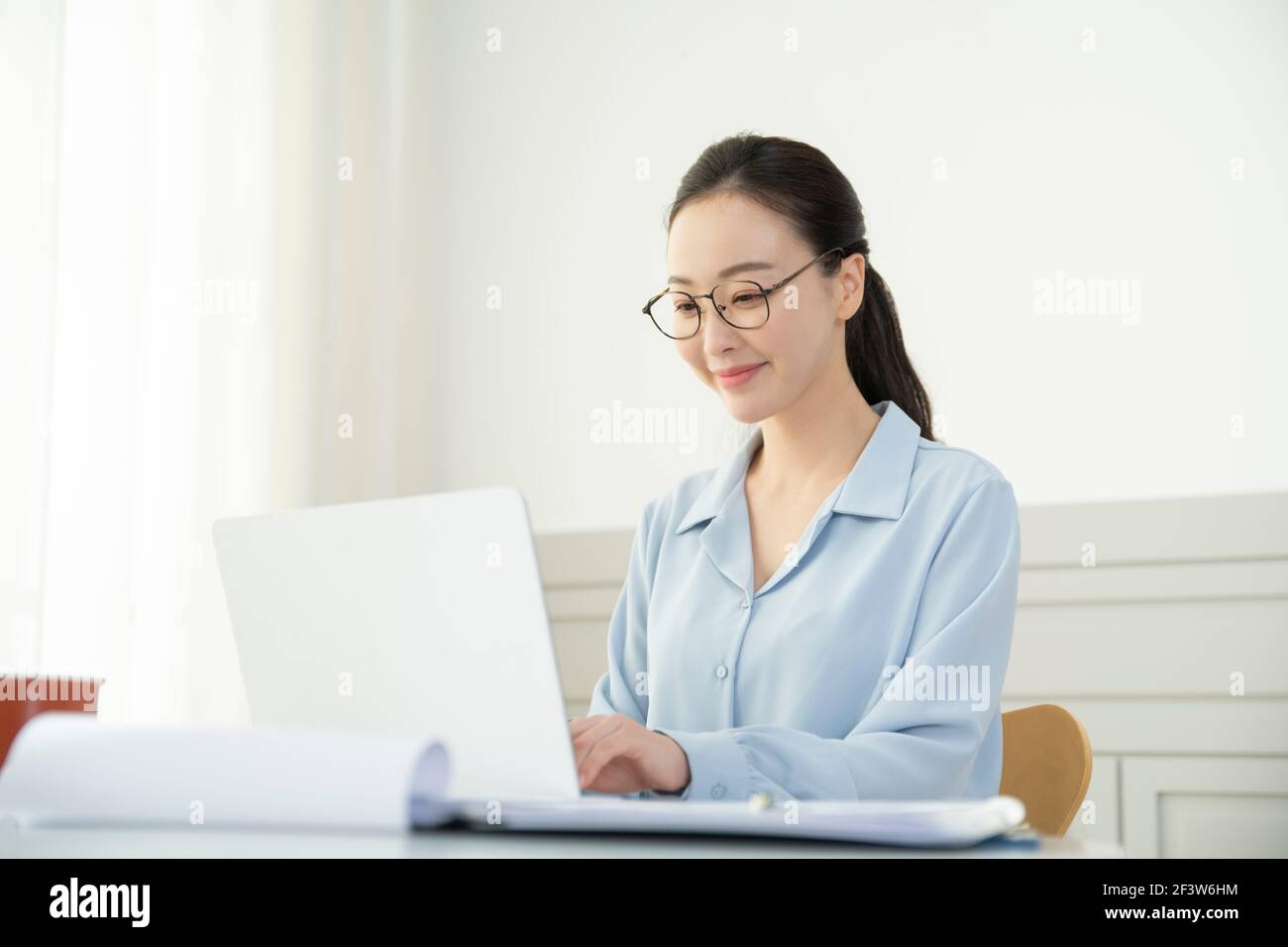 remote work, working at home concept of Asian woman in smart casual