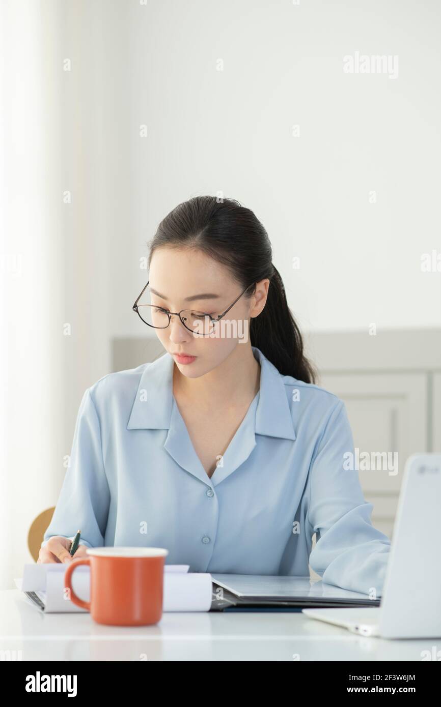 remote work, working at home concept of Asian woman in smart casual