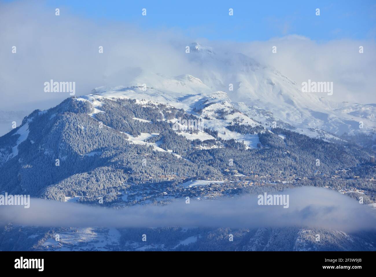 Ths luxury ski resort of Crans Montana in the mist in the Southern Swiss Alps, in the winter Stock Photo