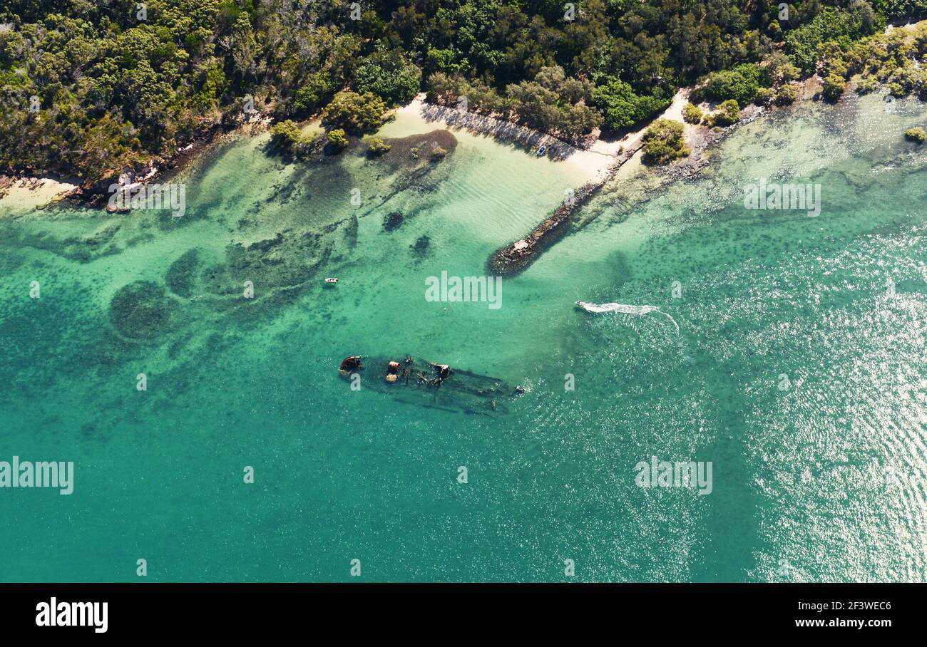 Aerial view of a shipwreck in the Coral sea near Peel island, Queensland, Australia. Stock Photo