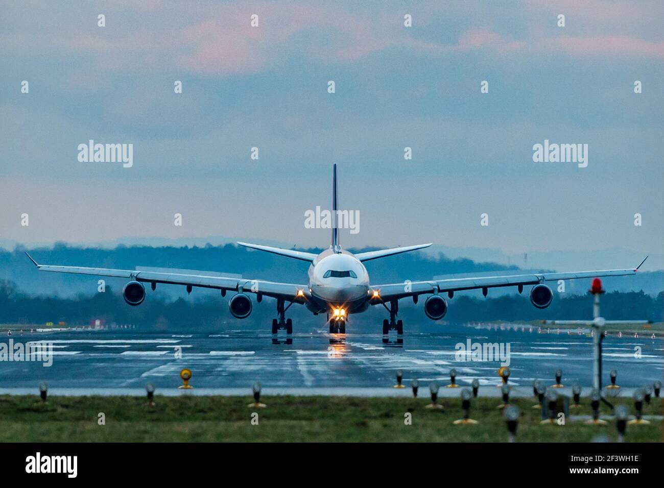 hoersching, austria, 17 march 2021, airbus a-340 operated by hi fly malta landing at the airport of linz Stock Photo