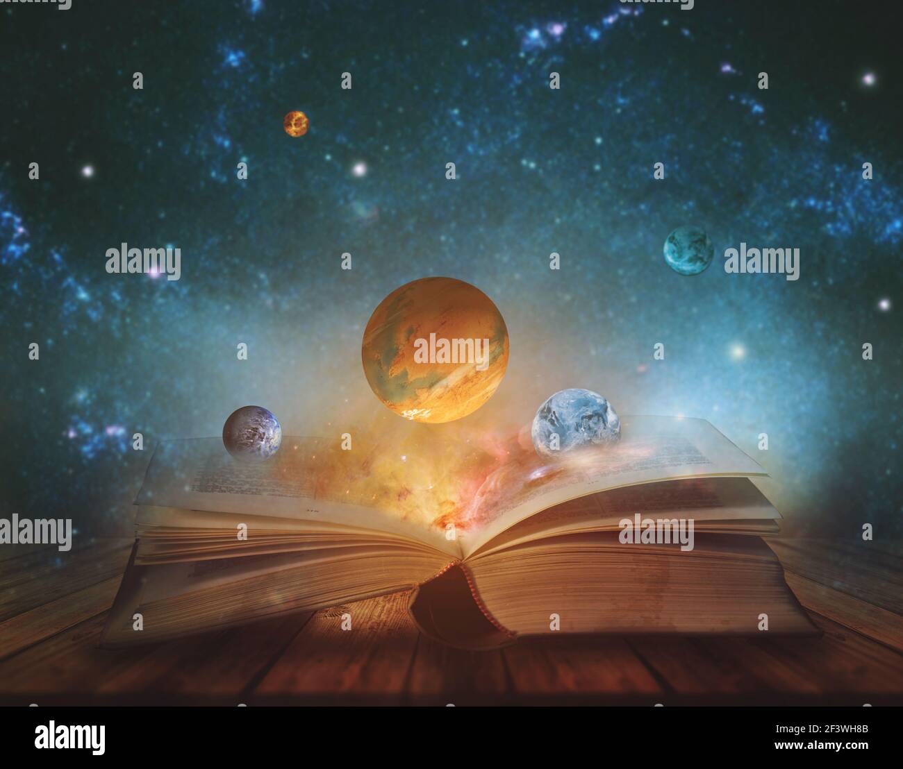 Book of the universe - opened magic book with planets and galaxies. Elements of this image furnished by NASA Stock Photo