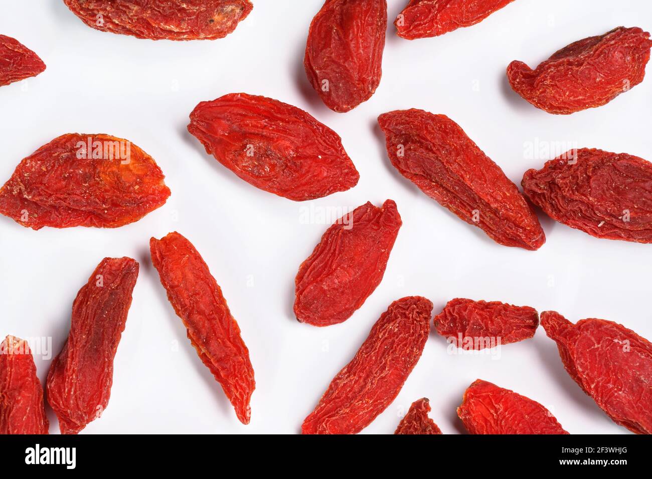 Closeup photo of goji berry (wolfberry - Lycium chinense) dried fruits isolated on white background, view from above Stock Photo