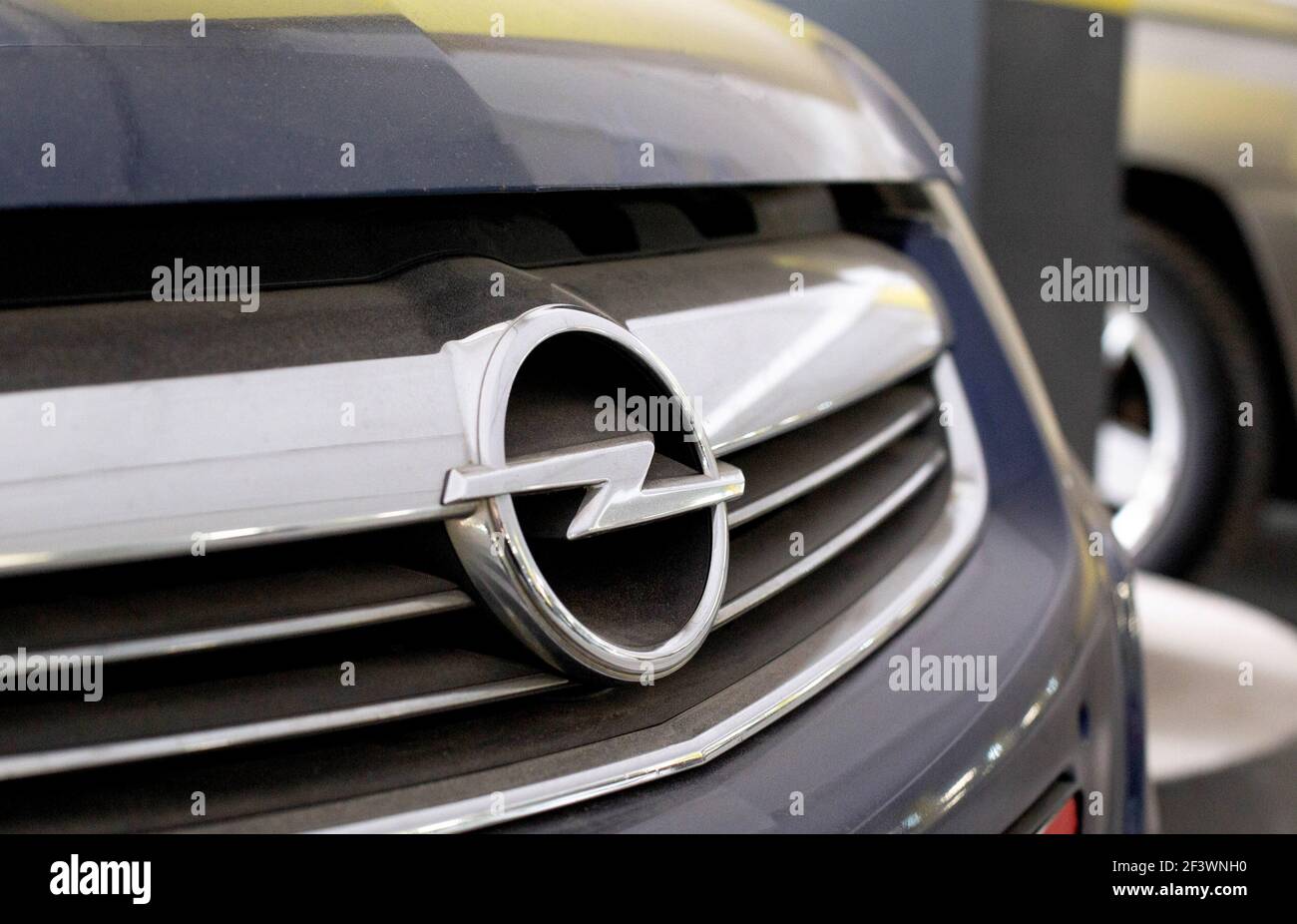 MINSK, BELARUS 07.10.19: Opel car emblem on the car hood. Concept