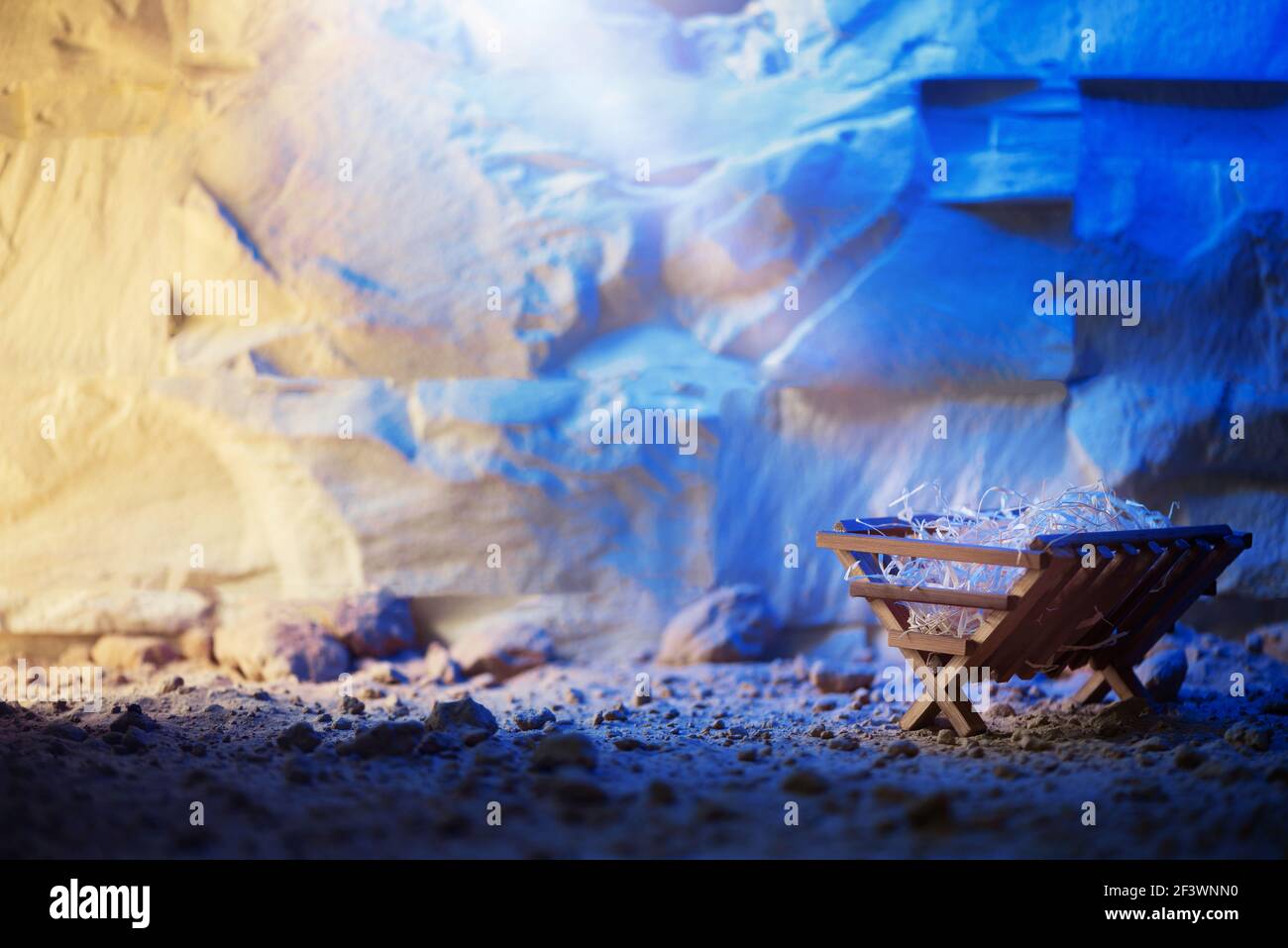 Wooden manger and star of Bethlehem in cave, nativity scene background ...