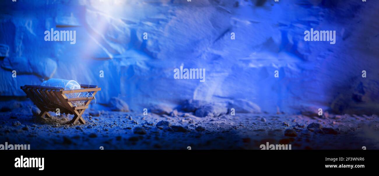 Wooden manger and star of Bethlehem in cave, nativity scene background ...