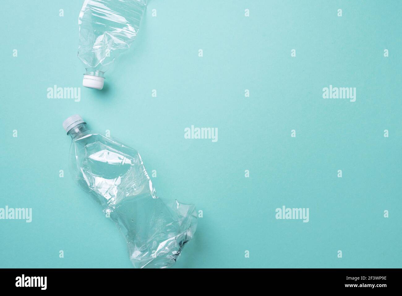 Plastic bottles on blue background. top view. Recycle plastic, waste pollution concept. Top view, copy space. Environmental protection concept. Reuse Stock Photo