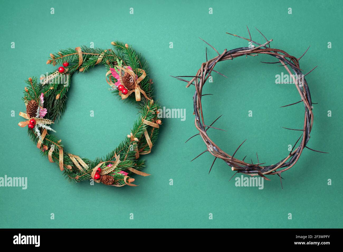 Christmas wreath and crown of thorns on green background. Remember the