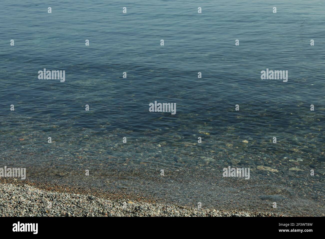 Amazing sea with clear water and pebbles sea shore Stock Photo - Alamy