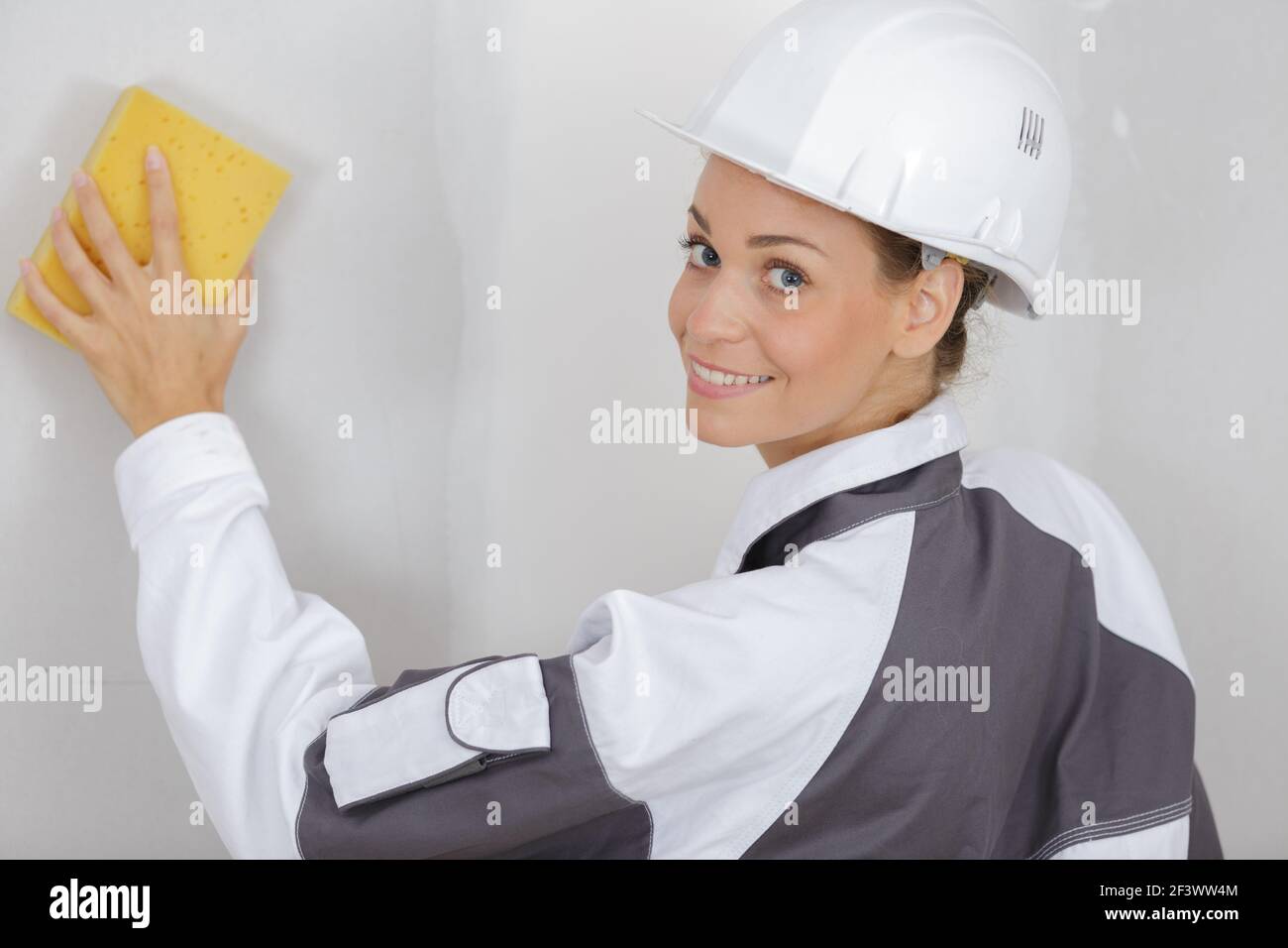 woman at work washing the wall Stock Photo Alamy