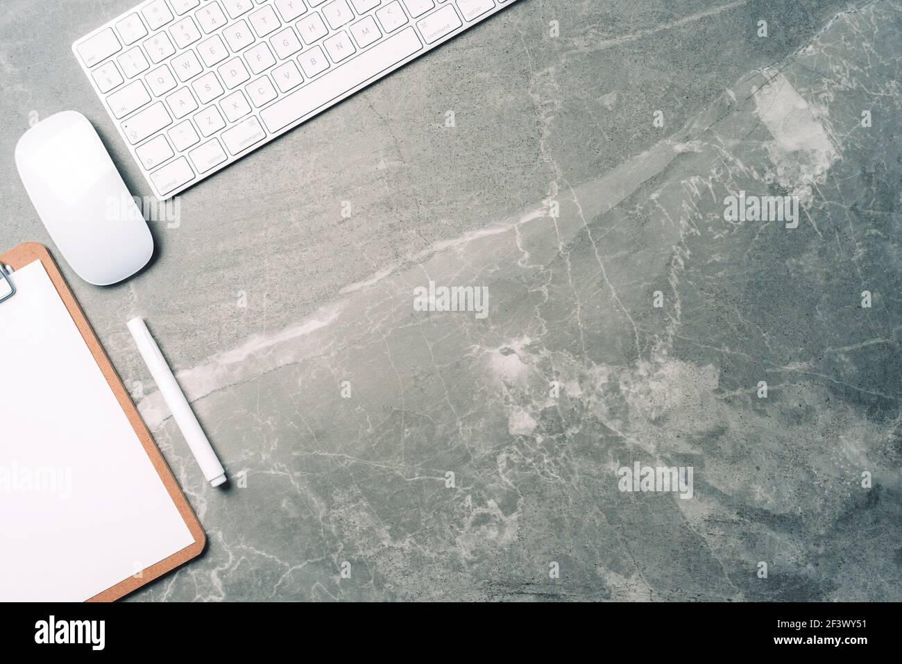 Business composition with white computer keyboard, mouse, clipboard, paper on marble background. Coffee break concept. Top view with copy space for Stock Photo