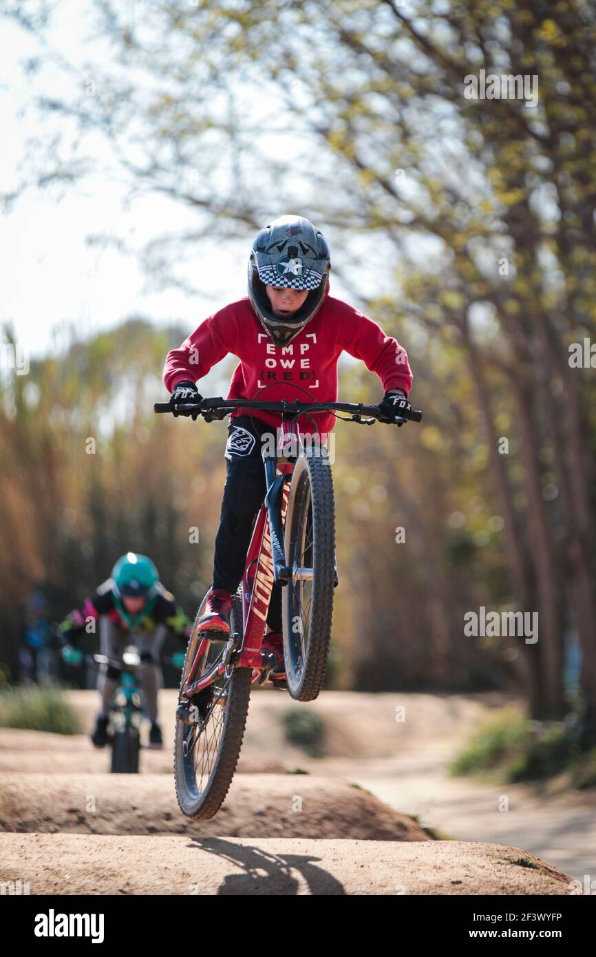 Mountain bike rider performing dirt jumps at La Poma Bike Park near