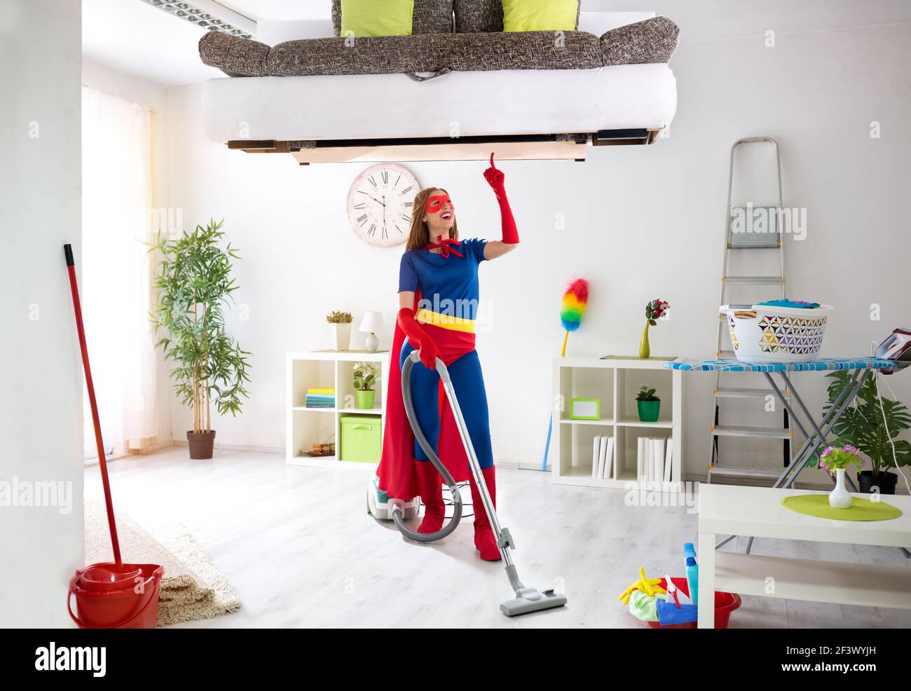 Worth super hero woman in costume use vacuum cleaner, hygiene time