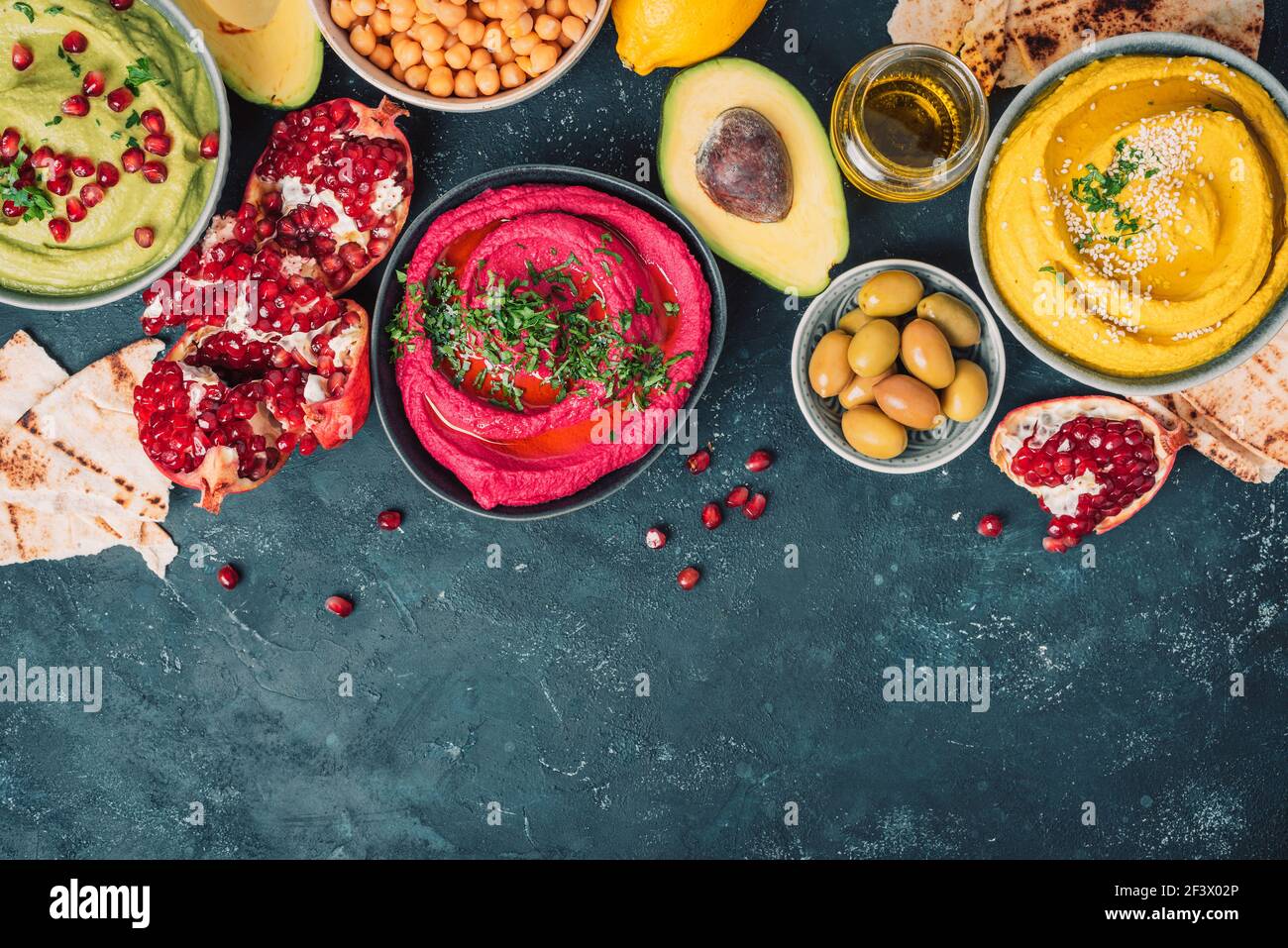Ingredients for yellow turmeric hummus, green parsley hummus and red