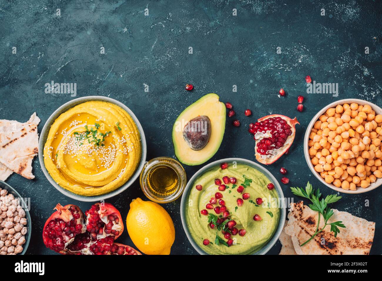 Ingredients for yellow hummus and green hummus chickpea, tahini