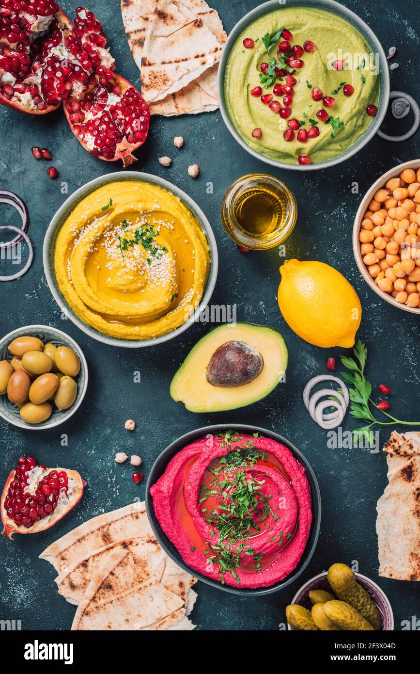 Ingredients for yellow turmeric hummus, green parsley hummus and red