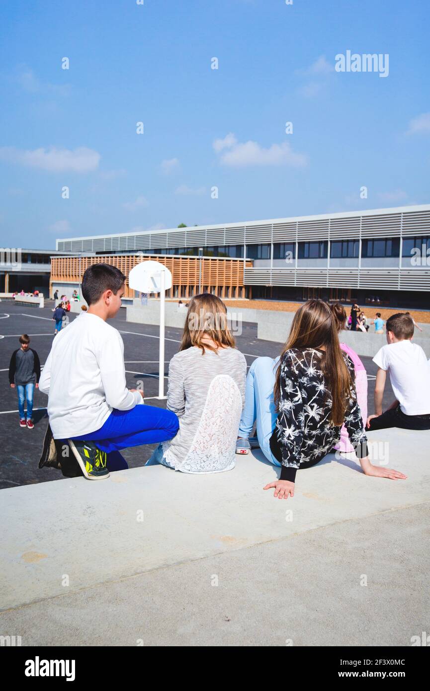 Atmosphere with pupils in the schoolyard of the “College Simone Veil” junior high school in Crevin (Brittany, north-western France) Stock Photo
