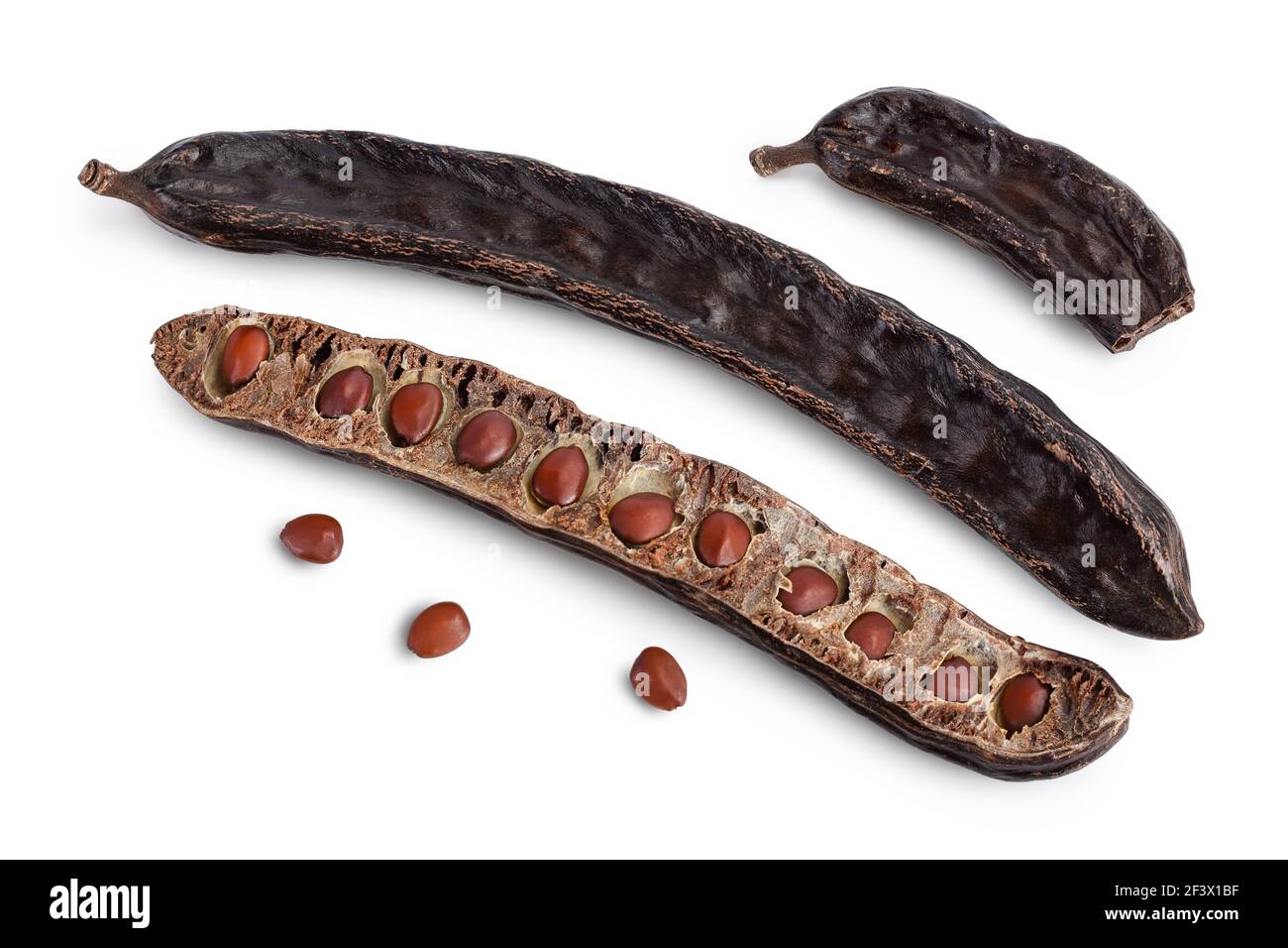 Ripe carob pods and bean isolated on white background with clipping