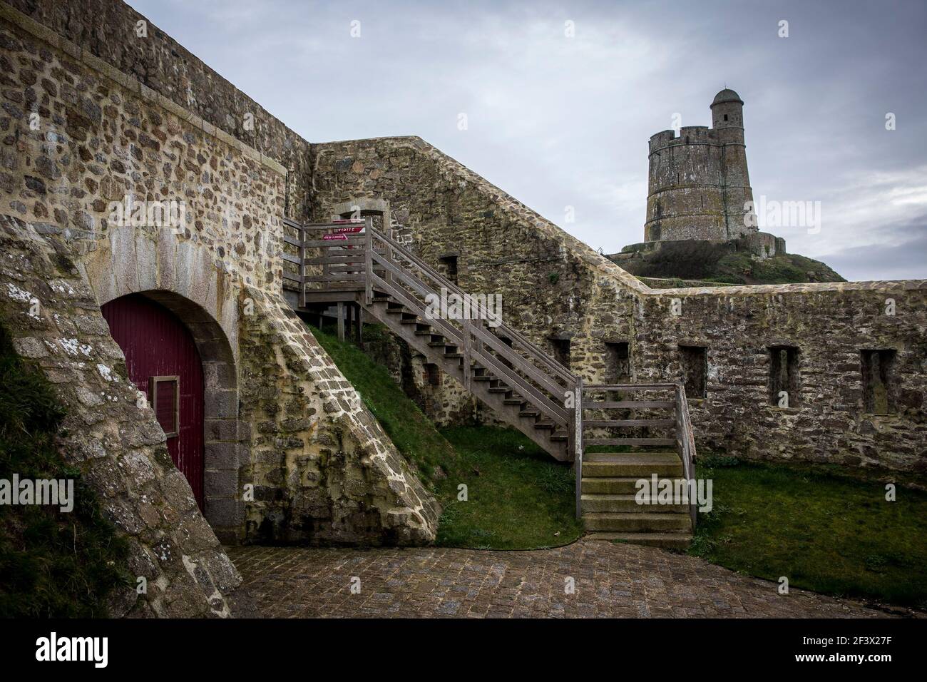 Islet of Tatihou (Normandy, north-western France): overview of the Vauban's tower registered as a UNESCO World Heritage Site, in the natural harbour o Stock Photo