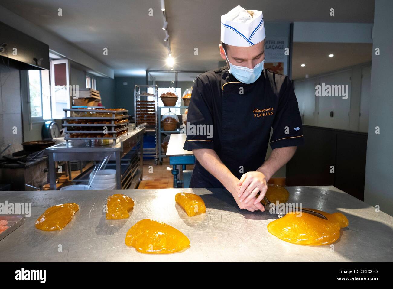 Confectionery, candy making at the candy store “Confiserie Florian” in Nice (south-eastern France), traditional production. Cooling of glucose syrup, Stock Photo