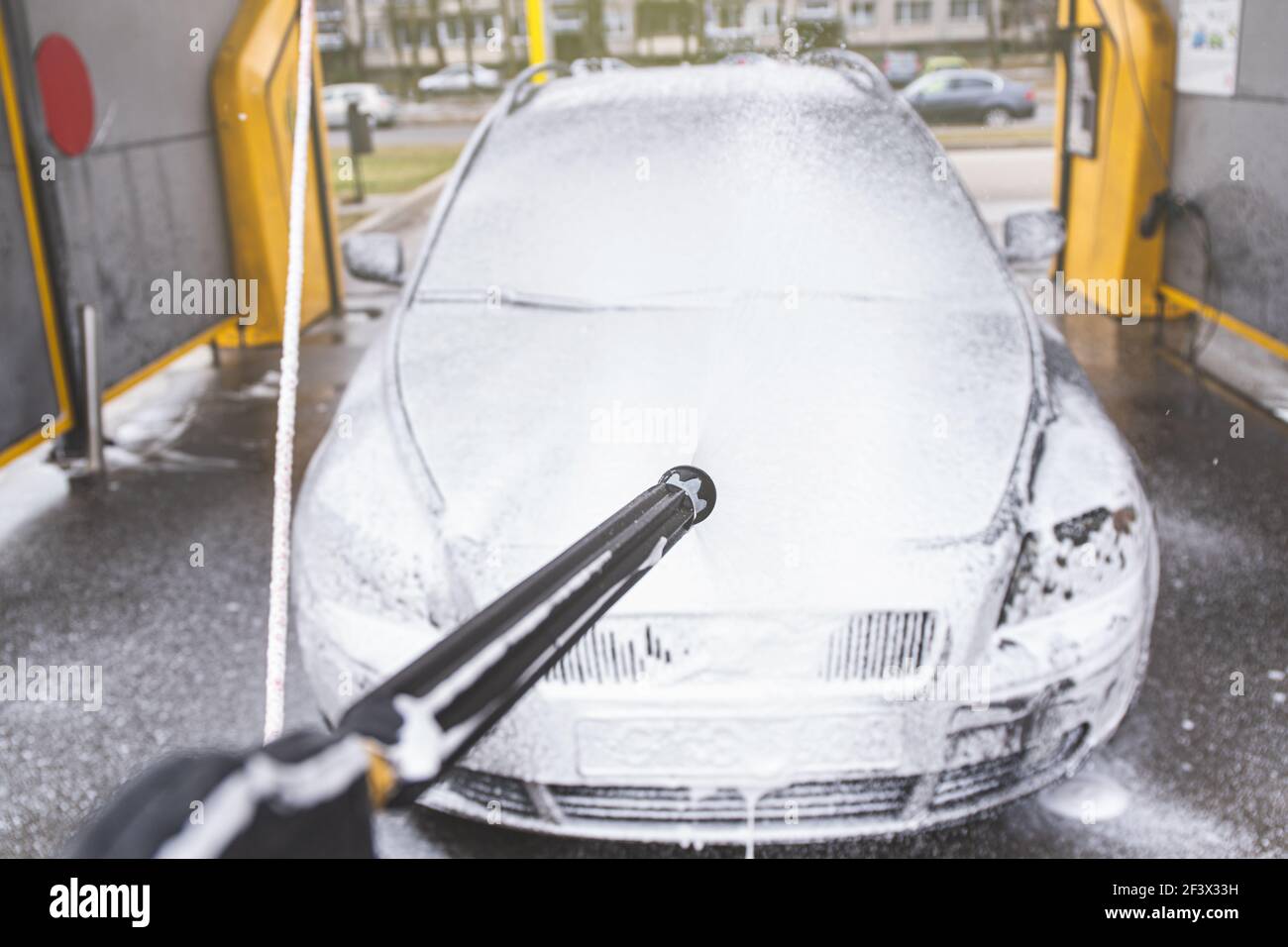 Contactless car wash self service system. Washing dirty car in car wash