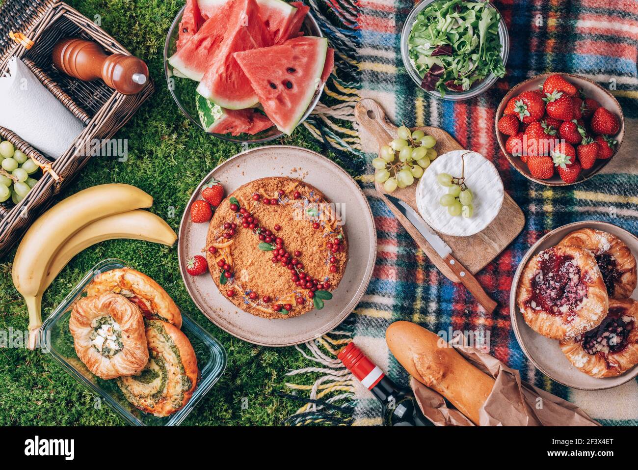 Picnic straw basket with healthy food, accessories. Summer picnic with