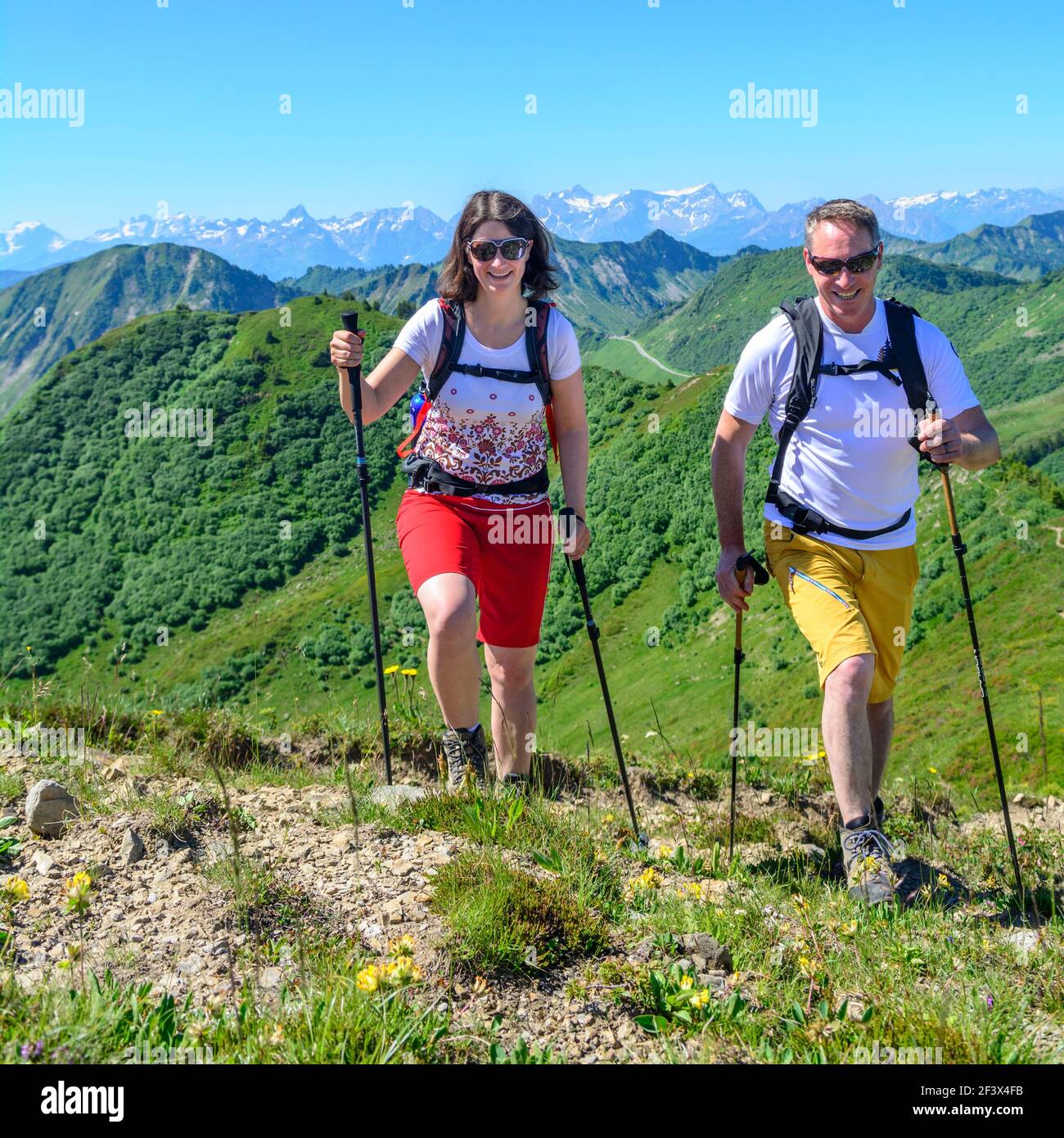 Couple hiking in alpine area in Vorarlberg mountains in austria Stock ...