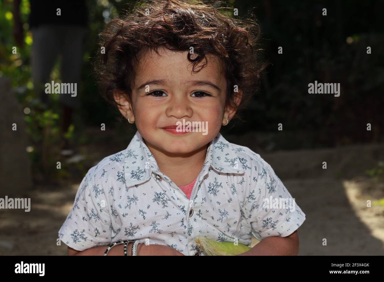 Portrait photo of A small Indian Asian little boy looking at the camera smiling, india Stock Photo