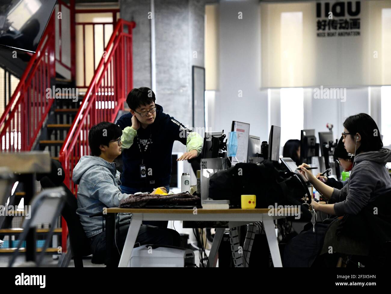 Tianjin. 17th Mar, 2021. Staff members of an animation company work at the national animation industry park in north China's Tianjin on March 17, 2021. The animation park which integrates animation production, Tianjin. 17th Mar, 2021. Staff members of an animation company work at the national animation industry park in north China's Tianjin on March 17, 2021. The animation park which integrates animation production,