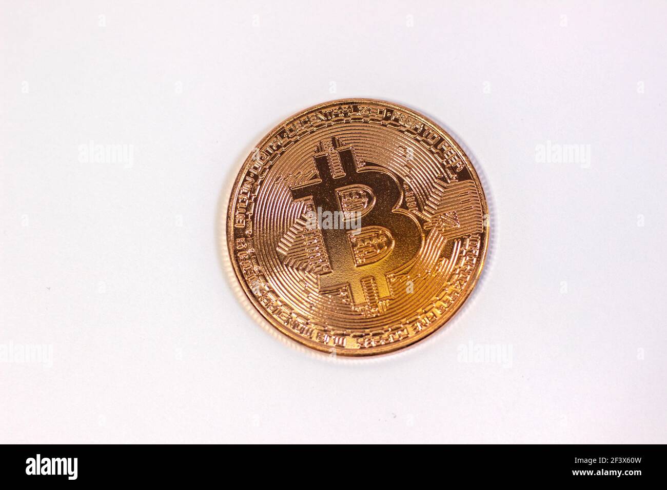 Physical bitcoin coin. Bitcoin on white background. Stock Photo