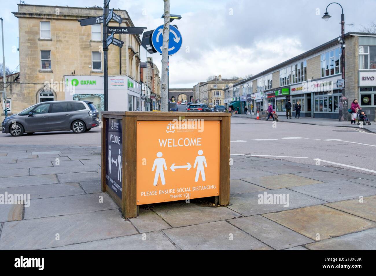 A social distancing street sign telling people to abide by the covid coronavirus social distancing rules is pictured in Chippenham, Wiltshire, UK Stock Photo