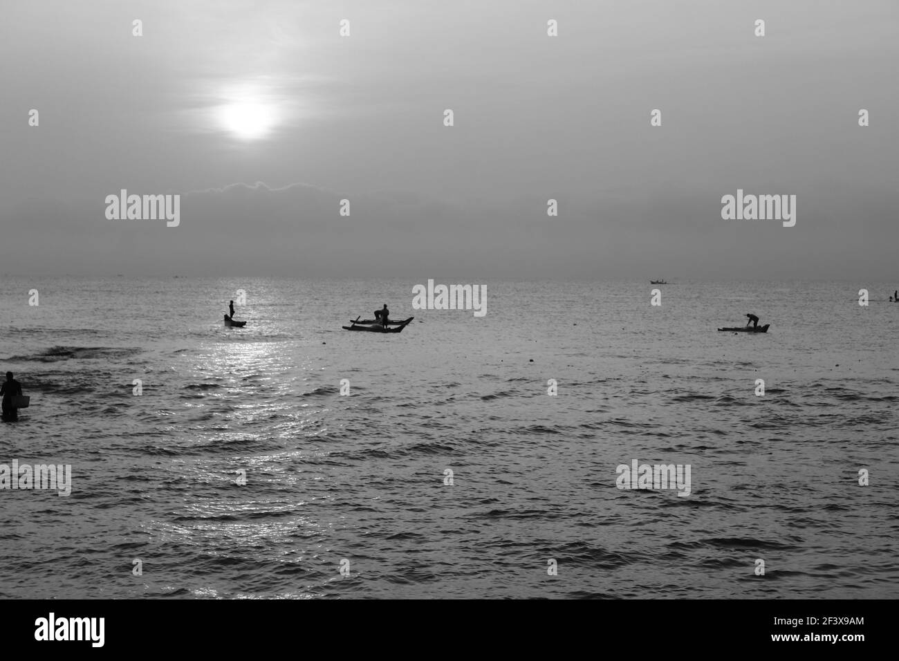 Monochrome picture of fishermen at Pondicherry beach Stock Photo