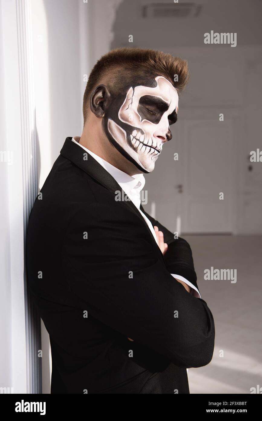 Skull make up portrait of young man. Halloween face art Stock Photo - Alamy