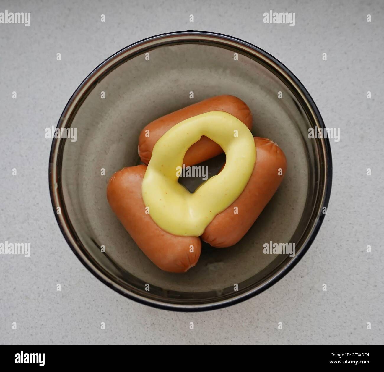 Sausages with French sauce in glassware, top view Stock Photo Alamy