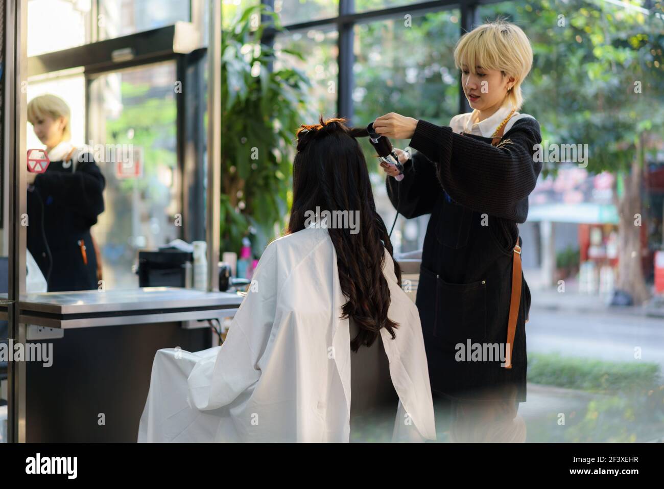 Curly hairdresser hi-res stock photography and images - Alamy