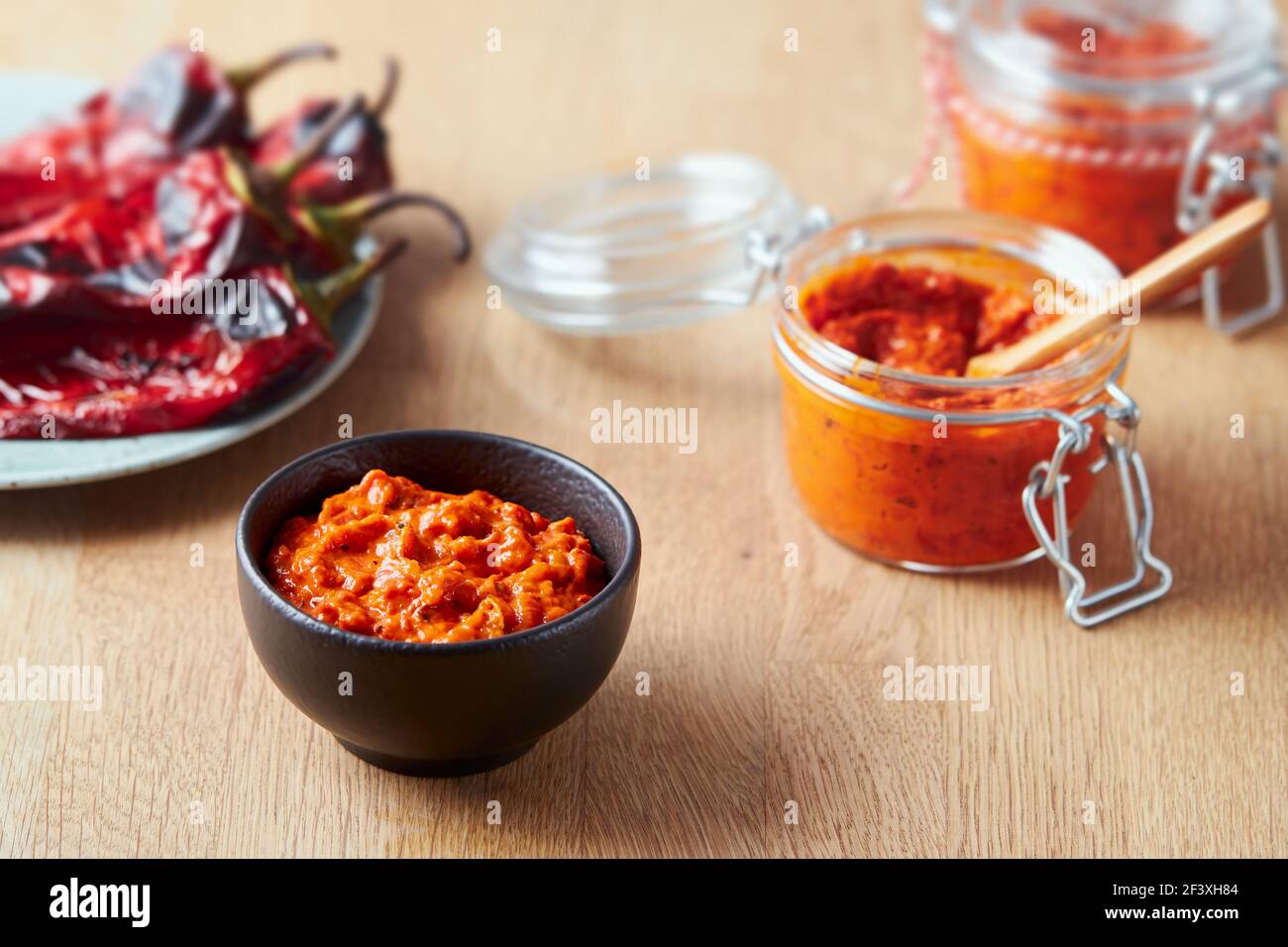 Roasted red pepper relish (Ajvar) in a small bowl Stock Photo