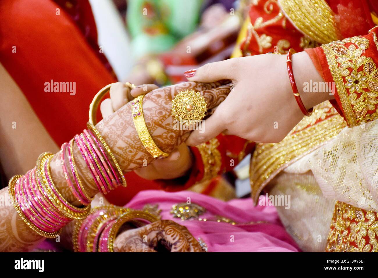 The bride wearing bangles hand closeup bride getting ready for ...
