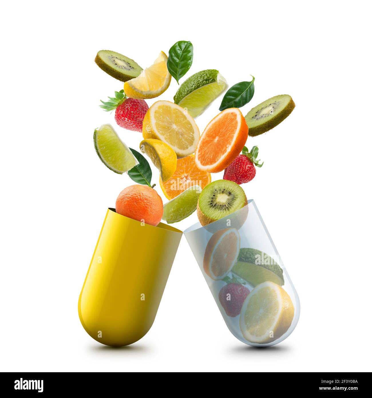 vitamin c pill open with citrus fruits jumping out Stock Photo