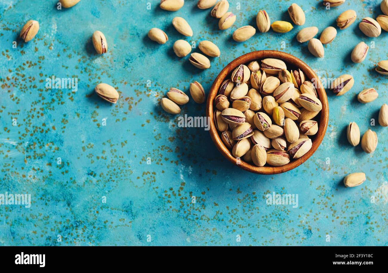 Roasted and salted pistachios in a bowl, ready to eat. Stock Photo