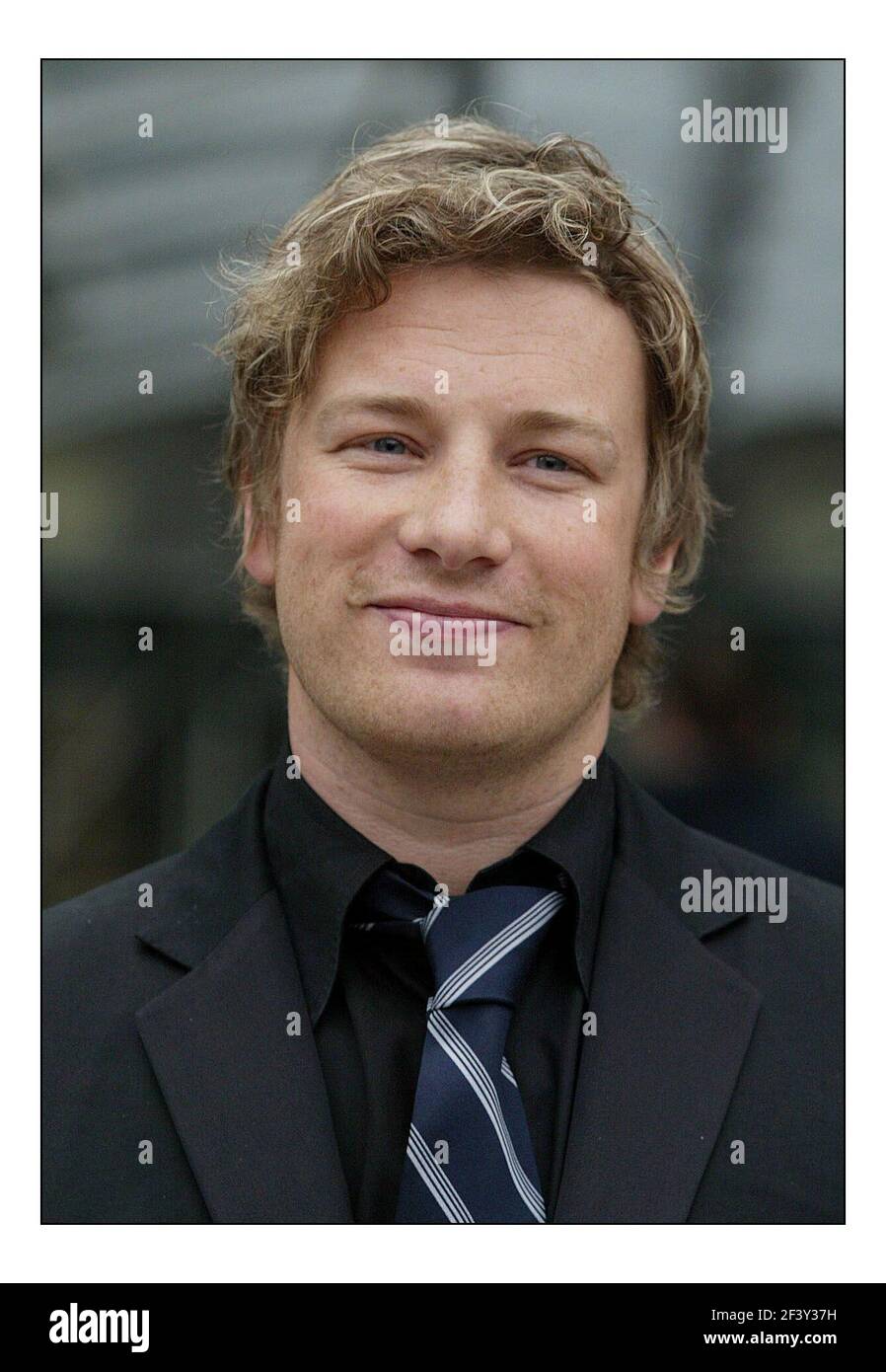 Jamie Oliver at a photocall before his press conf re school dinners held at Channel Four in Londonpic David Sandison 30/3/2005 Stock Photo