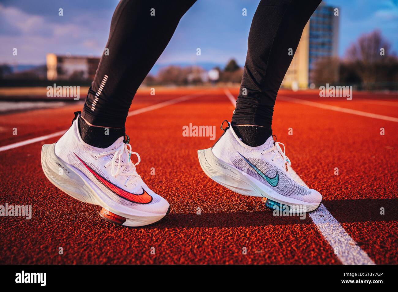 TOKYO, JAPAN, MARCH 18. 2021: running shoes ALPHAFLY NEXT%. Controversial athletics shoe on legs of professional athlete running on the road. Off Stock Photo - Alamy