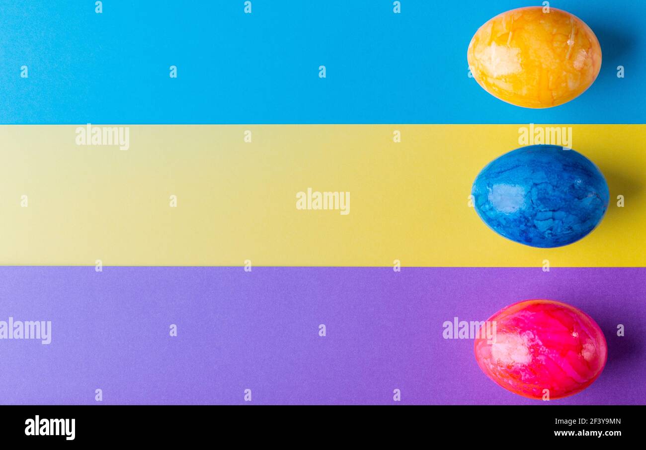 Multicolor geometric background with easter eggs. Stock Photo